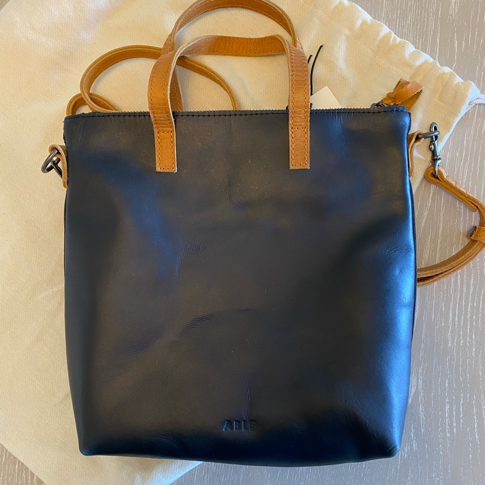 Magnolia purse. New with tags and dust bag